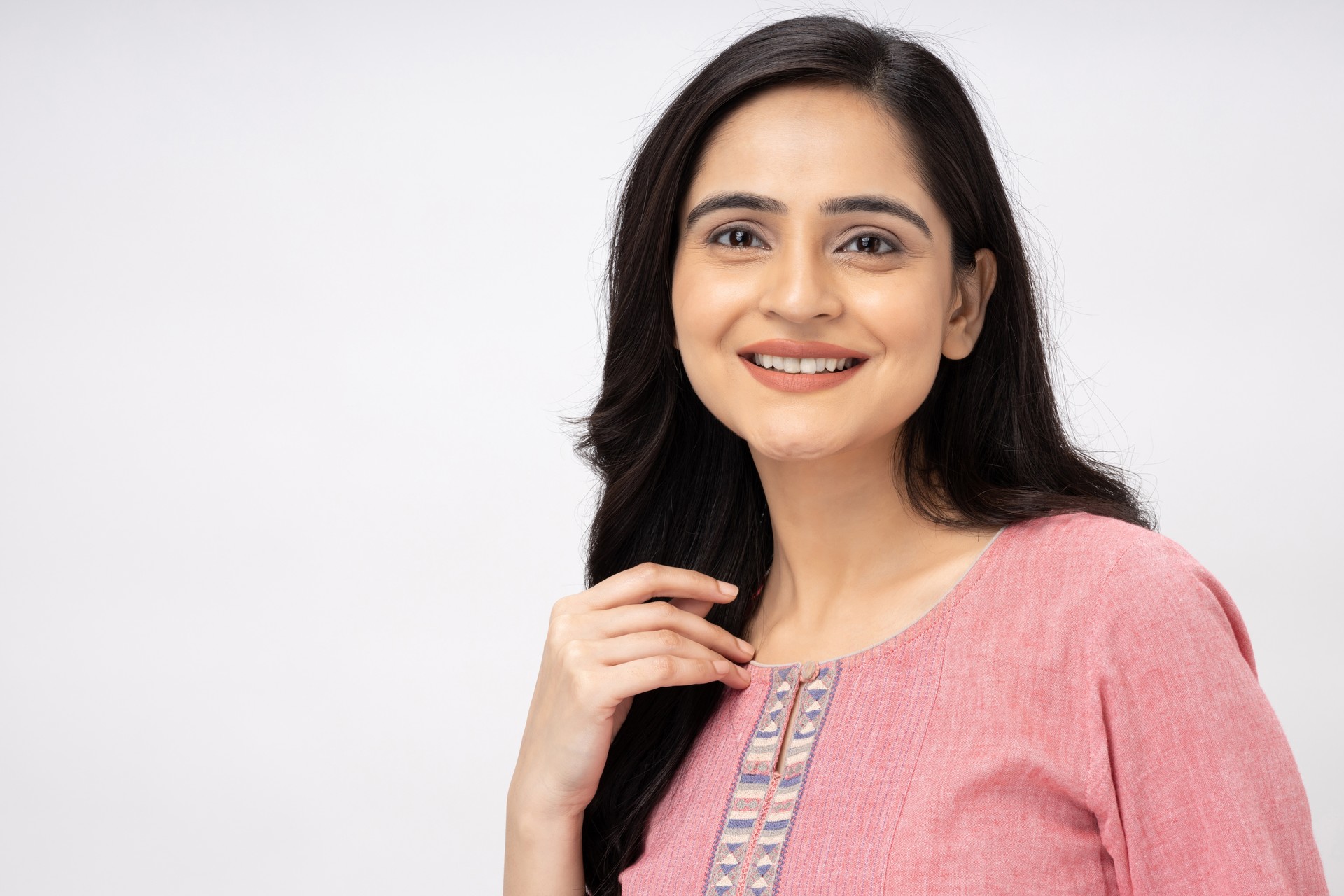 Portrait of Indian young woman wearing casual kurta on white background stock photo